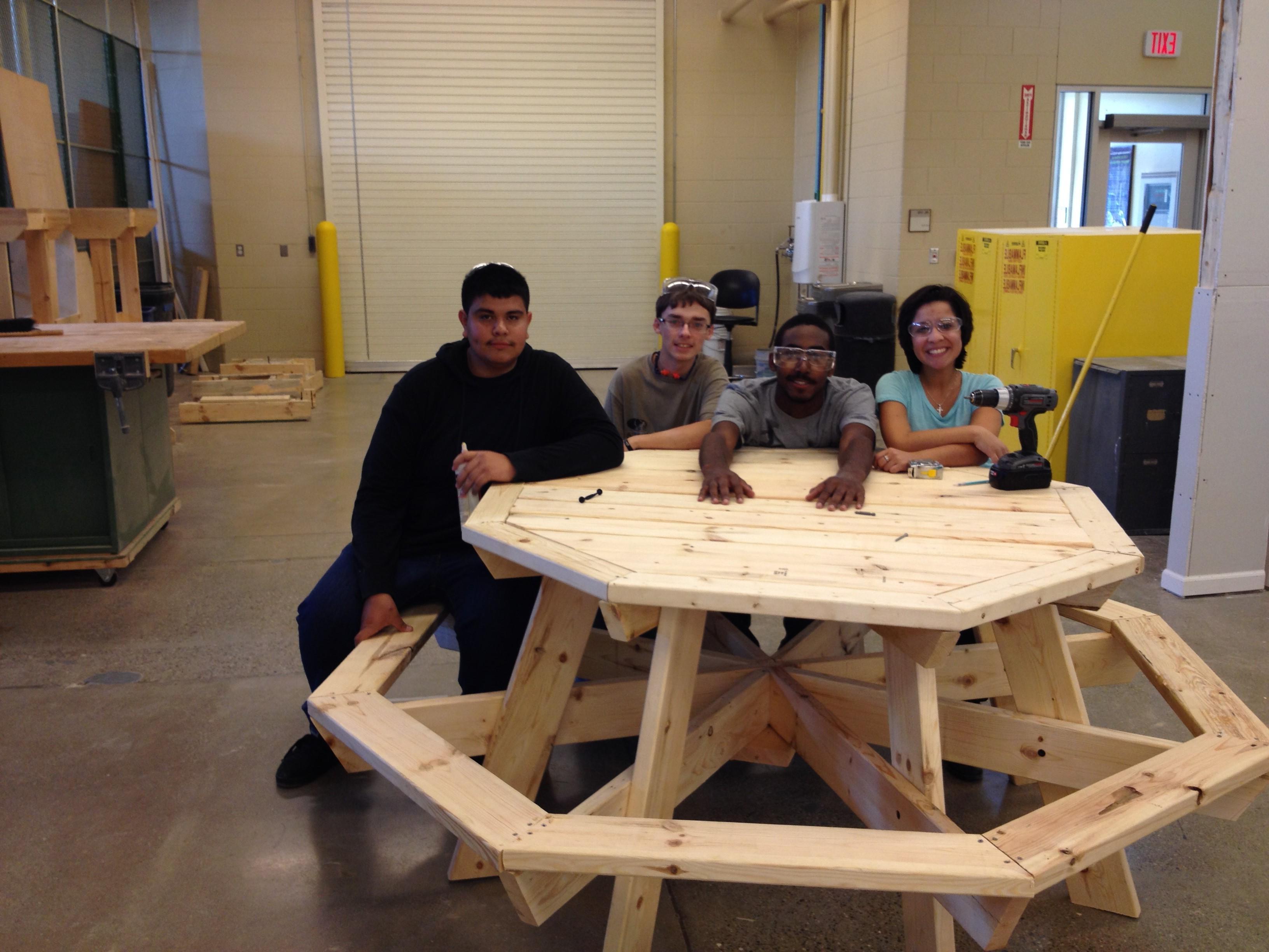 Construction students build a picnic table for local non-profit Growing Hope